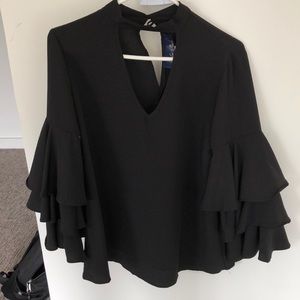 Francesca’s blue rain black ruffle sleeve top